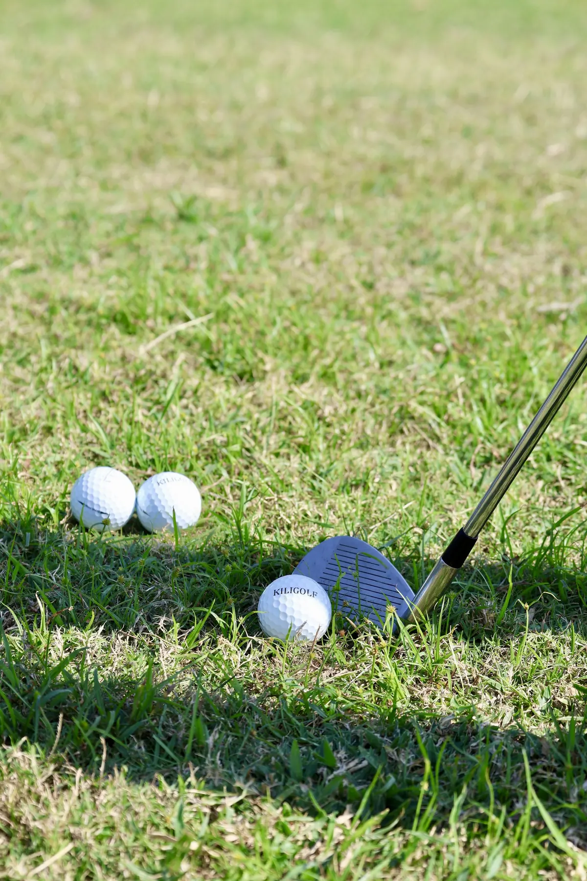 KiliGolf balls and a wedge, ready for a round